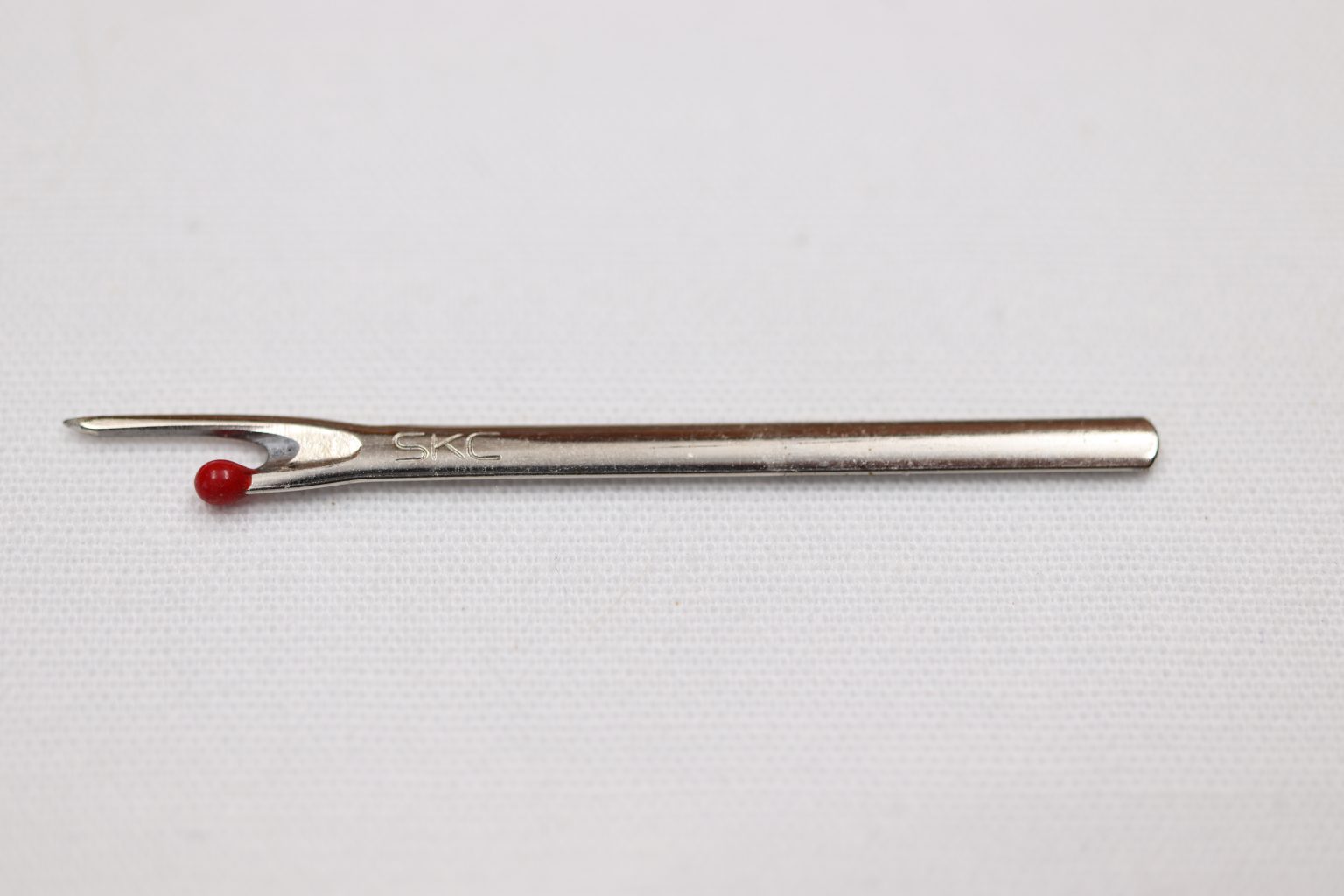 A Seam Ripper Replacement Blade for ripper with black "O" rings