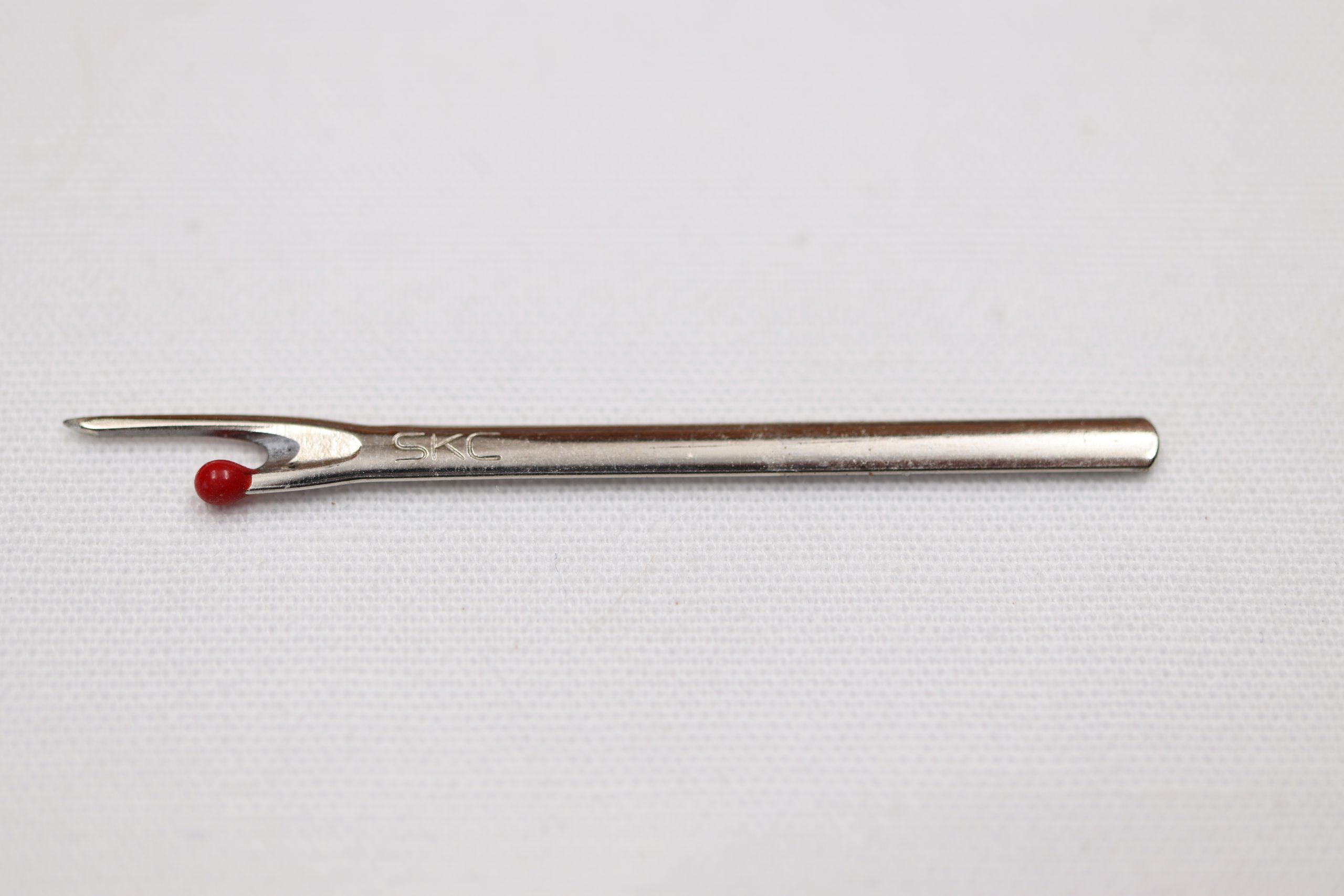 A Seam Ripper Replacement Blade for ripper with black O rings